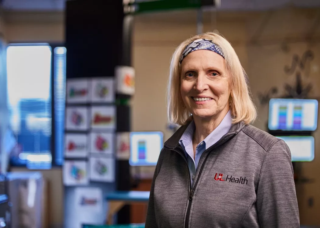 Andrea Behrman, pictured smiling in her research lab
