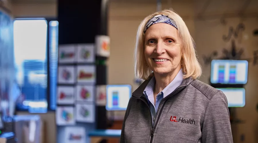 Andrea Behrman, pictured smiling in her research lab