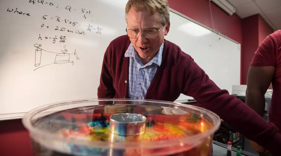 Professor works on a science experiment