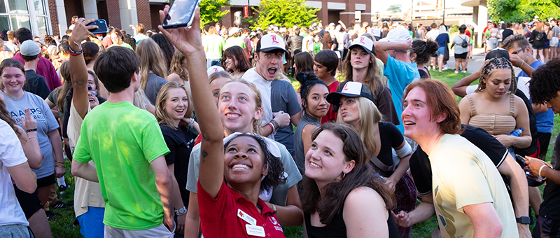 Students posing for a group selfie.