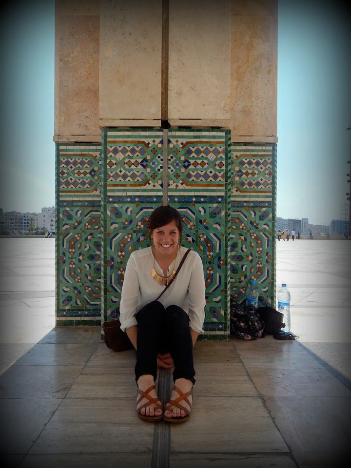 Girl sitting in front of Pillar 