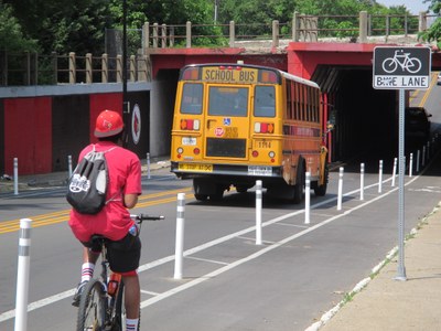 4th Street bike lanes featuring new delineator posts installed May 2015 under the railroad overpass.