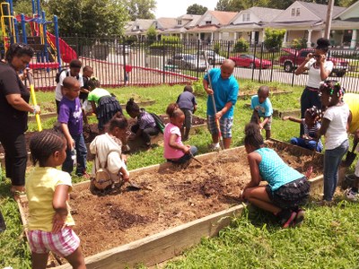 UofL Compost fills beds at New Directions Brandeis Housing Garden (Summer 2013)