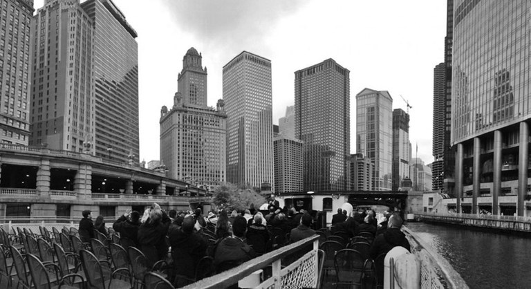 people on a river ferry ride through the city