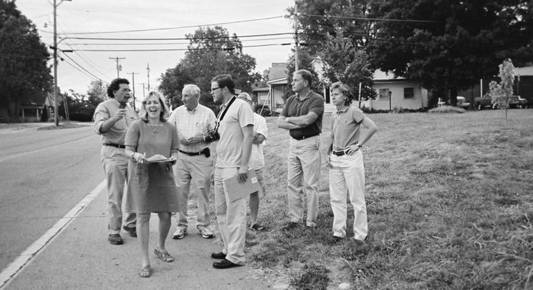 group of surveyors walking down the street