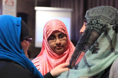 Students Trying on Hijabs IWD14