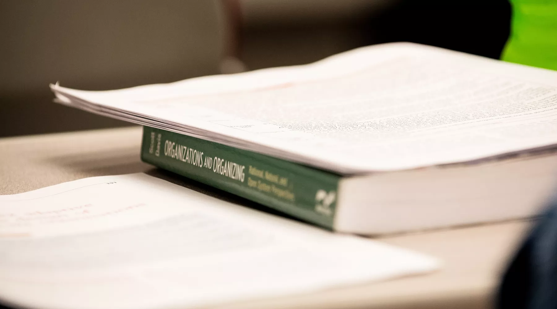 Close up image of a textbook in School of Public Health and Information Sciences.