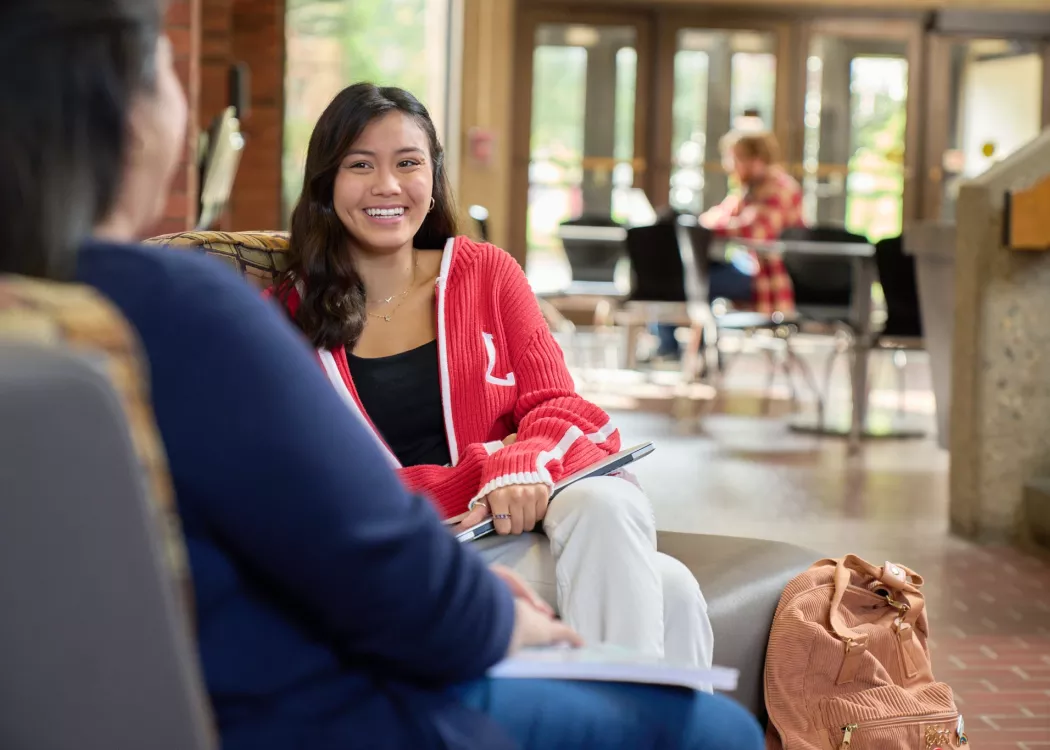 Two students talking in the CEHD.
