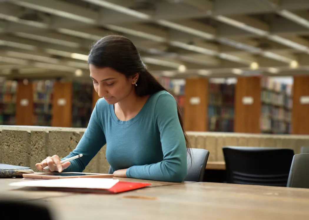 Student studying in the library.